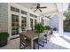 Covered patio featuring a dining table, ceiling fan, and access to the home through french doors at 479 Argonne Nw Dr, Atlanta, GA 30305