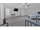 Spacious main bedroom featuring a ceiling fan, TV and neutral-toned carpet at 74 Macland Mill Ln, Dallas, GA 30157