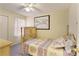 Bedroom featuring a floral patterned quilt, ceiling fan, and neutral walls at 2141 Summerchase Dr, Woodstock, GA 30189