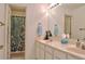 Well-lit bathroom with double vanity, large mirror, and shower at 401 Iona Abbey Se Ct # 6, Smyrna, GA 30082