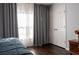 Cozy bedroom with hardwood floors, large window, and closet at 401 Iona Abbey Se Ct # 6, Smyrna, GA 30082