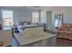 Bright bedroom with a large rug, chair, dresser and two windows at 401 Iona Abbey Se Ct # 6, Smyrna, GA 30082