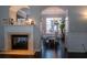 Fireplace, with an archway view into a bright dining room featuring white chairs and table at 401 Iona Abbey Se Ct # 6, Smyrna, GA 30082
