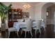 Bright dining room with hardwood floors, chandelier lighting, and furniture at 401 Iona Abbey Se Ct # 6, Smyrna, GA 30082