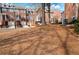 A row of brick townhouses, with well-maintained lawns and mature trees at 401 Iona Abbey Se Ct # 6, Smyrna, GA 30082