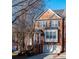 Charming brick townhome featuring a front-facing garage, black shutters, and inviting front entrance at 401 Iona Abbey Se Ct # 6, Smyrna, GA 30082