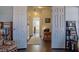 Hallway with dark hardwood floors, white doors, and rug at 401 Iona Abbey Se Ct # 6, Smyrna, GA 30082