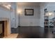 Cozy living room with dark wood floors, fireplace, and neutral wall color at 401 Iona Abbey Se Ct # 6, Smyrna, GA 30082