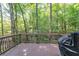 Back deck overlooking mature trees with grill and privacy at 2208 Clarendon Ne Ct, Conyers, GA 30012