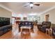 Open-concept living space with hardwood floors, coffered ceiling, and seamless flow to the kitchen and dining area at 2208 Clarendon Ne Ct, Conyers, GA 30012