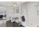 Bright bathroom featuring double sinks, glass shower, white subway tile, and dark hardwood flooring at 289 9Th Ne St, Atlanta, GA 30309