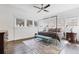 Sunlit bedroom with neutral-toned walls, windows, hardwood flooring, and four-poster bed at 289 9Th Ne St, Atlanta, GA 30309