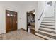 Welcoming foyer with hardwood floors, a beautiful rug, and an elegant staircase at 289 9Th Ne St, Atlanta, GA 30309