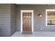 Elegant front door with a paneled design, and a stylish exterior light fixture at 289 9Th Ne St, Atlanta, GA 30309