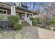 Lovely front exterior featuring a stone walkway, lush landscaping, and a welcoming porch at 289 9Th Ne St, Atlanta, GA 30309