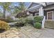 Stunning home featuring stone stairs, mature trees, and a charming pond with koi fish at 289 9Th Ne St, Atlanta, GA 30309