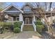 Charming two-story home with landscaped front yard, stone path and elegant porch at 289 9Th Ne St, Atlanta, GA 30309