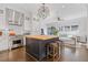 Spacious kitchen featuring an island with seating, modern appliances, and stylish lighting fixtures at 289 9Th Ne St, Atlanta, GA 30309