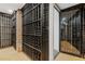 Wine cellar with ample storage racks and custom glass door at 289 9Th Ne St, Atlanta, GA 30309