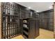 Spacious wine cellar with ample storage racks and custom center island at 289 9Th Ne St, Atlanta, GA 30309