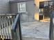 Back deck overlooking yard with sliding glass doors leading inside the home at 2976 Nelson Dr, Duluth, GA 30096