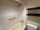 Bathroom showcasing a tub, shower, shelving, and a toilet at 2976 Nelson Dr, Duluth, GA 30096