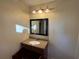 Bathroom featuring a large mirror, vanity with granite countertop, and lighting fixture at 2976 Nelson Dr, Duluth, GA 30096