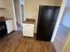 Cozy kitchen with wood floors, granite countertops, and black appliances at 2976 Nelson Dr, Duluth, GA 30096