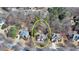 Aerial view of a beautiful house in a mature, tree-filled neighborhood at 4260 River Club Dr, Cumming, GA 30041