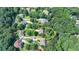 Aerial view of the home surrounded by lush trees in a well-established neighborhood at 4260 River Club Dr, Cumming, GA 30041