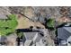 Aerial perspective showcasing a deck with outdoor seating area, and trees, highlighting the property's outdoor living space at 4260 River Club Dr, Cumming, GA 30041