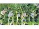 Birds eye view of the home and lot surrounded by lush trees in a well-established neighborhood at 4260 River Club Dr, Cumming, GA 30041