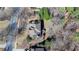 Aerial view of a home surrounded by trees, showcasing its well-maintained roof and property at 4260 River Club Dr, Cumming, GA 30041