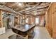 Unfinished basement with a pool table, water heater, and space for storage and activities at 4260 River Club Dr, Cumming, GA 30041