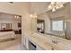 Bright bathroom with dual vanity, shower, bathtub and view into primary suite at 4260 River Club Dr, Cumming, GA 30041