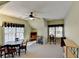 Bright bonus room with neutral walls, carpet, table, and ceiling fan at 4260 River Club Dr, Cumming, GA 30041