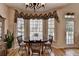 Charming breakfast nook with bay window, hardwood floors, and space for four makes dining a special treat at 4260 River Club Dr, Cumming, GA 30041