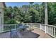 Spacious deck area perfect for outdoor entertaining with a table and seating for guests at 4260 River Club Dr, Cumming, GA 30041