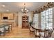 Dining area with natural light, hutch, wood floors, and access to kitchen at 4260 River Club Dr, Cumming, GA 30041