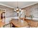 Elegant dining room with hardwood floors, chandelier, and view of the staircase at 4260 River Club Dr, Cumming, GA 30041