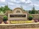 Elegant entrance sign for Chattahoochee River Club community, featuring stone accents and landscaping at 4260 River Club Dr, Cumming, GA 30041