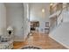 Bright and spacious foyer with hardwood floors, staircase, and view into the dining room at 4260 River Club Dr, Cumming, GA 30041