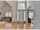 Grand foyer with hardwood floors, high ceilings, and view into the dining room, creating a luxurious entrance at 4260 River Club Dr, Cumming, GA 30041