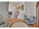 Open foyer features hardwood floors, staircase, and a view into other living spaces at 4260 River Club Dr, Cumming, GA 30041