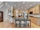 Large kitchen with stone countertops, wood cabinets, stainless steel appliances, and hardwood floors at 4260 River Club Dr, Cumming, GA 30041