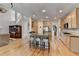 Spacious kitchen with eat-in bar overlooks the living area and staircase at 4260 River Club Dr, Cumming, GA 30041