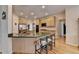 Spacious kitchen with light wood cabinets, granite countertops, and seating at the island at 4260 River Club Dr, Cumming, GA 30041
