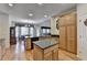 Open kitchen design featuring hardwood floors, center island, and ample cabinet space at 4260 River Club Dr, Cumming, GA 30041