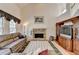 Bright living room with stone fireplace, large windows, hardwood floors and vaulted ceiling at 4260 River Club Dr, Cumming, GA 30041