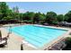 Large community pool with clearly marked lanes, plenty of lounge chairs, and shaded pergolas at 4260 River Club Dr, Cumming, GA 30041
